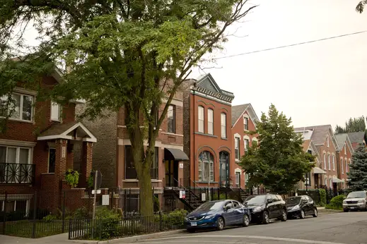 Vintage apartments and workers cottage homes on residential street in East Village