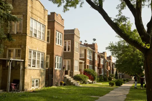 Vintage brick apartment buildings and sidewalk in North Mayfair