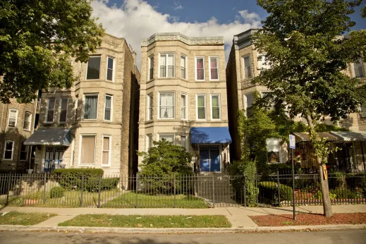 Vintage greystone three flat apartments in East Garfield Park Chicago