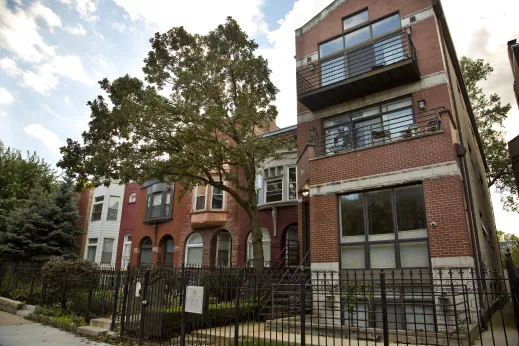 Vintage row home apartments beside modern townhouse apartments in Oakland Chicago