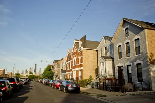 Vintage rowhomes and apartments with Chicago skyline in Noble Square Chicago