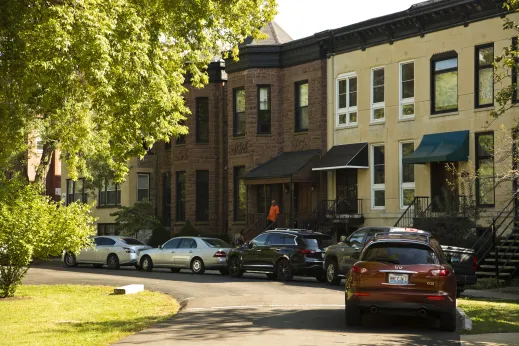 Vintage rowhouses and apartments on neighborhood street in Douglas Chicago