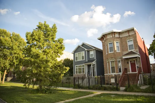 Vintage two flat apartments by new construction single family home in East Garfield Park Chicago
