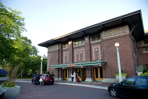 Wedding guests at Cafe Brauer entrance at Lincoln Park Zoo in Lincoln Park