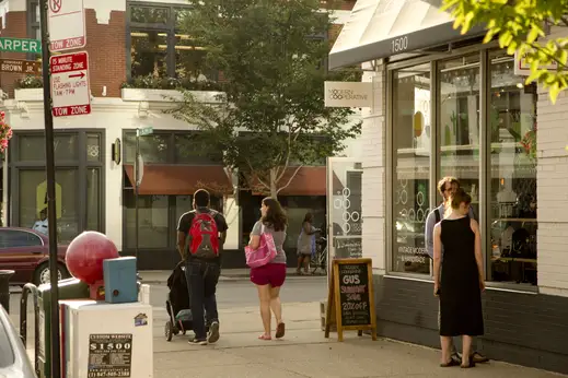 Window shoppers outside Modern Cooperative storefront in Hyde Park