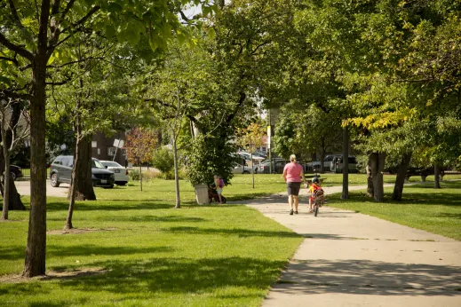 Woman and children on bike path in Jefferson Park Chicago