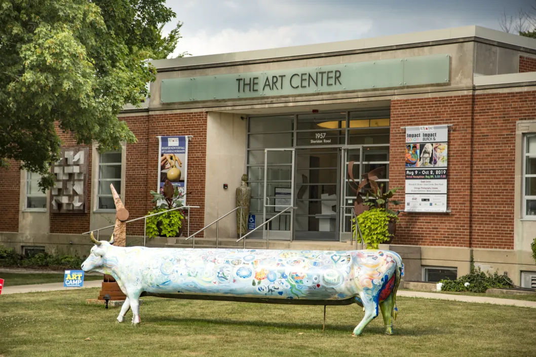 Highland Park Art center with cow sculpture in front