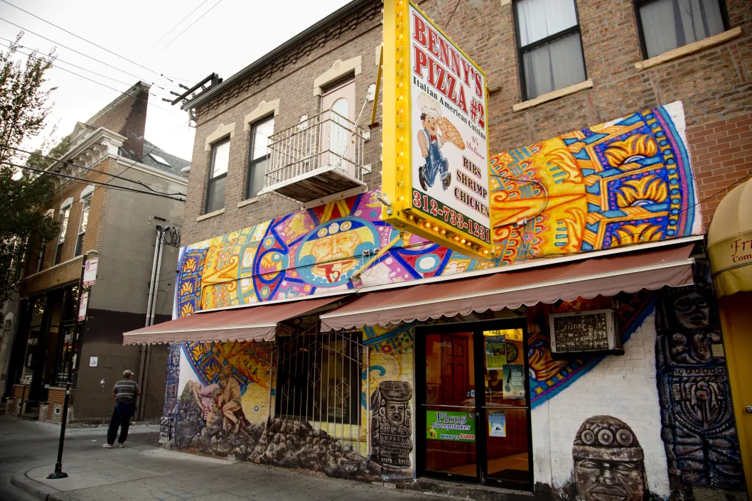 Benny's Pizza restaurant exterior murals on 18th Street in Pilsen Chicago