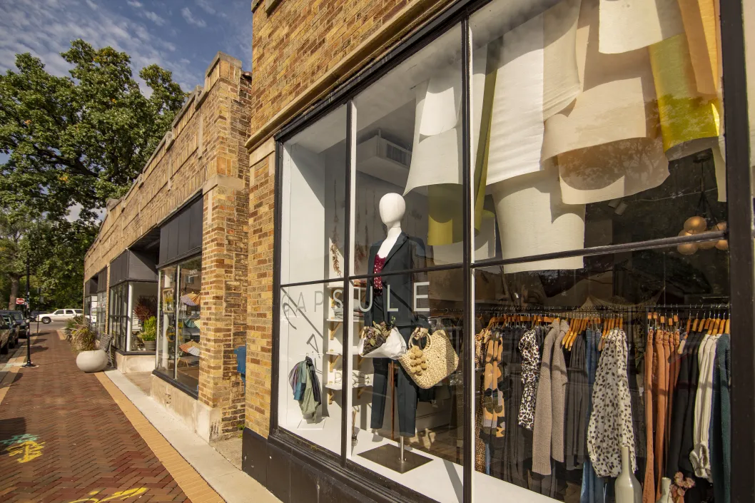 capsule womens clothing store from its sidewalk storefront in Washington Heights Chicago