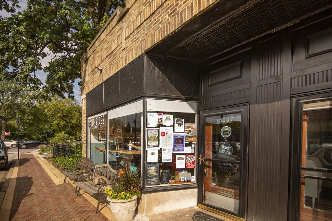 coffee shop next to sidewalk and outdoor bench in Auburn Gresham Chicago