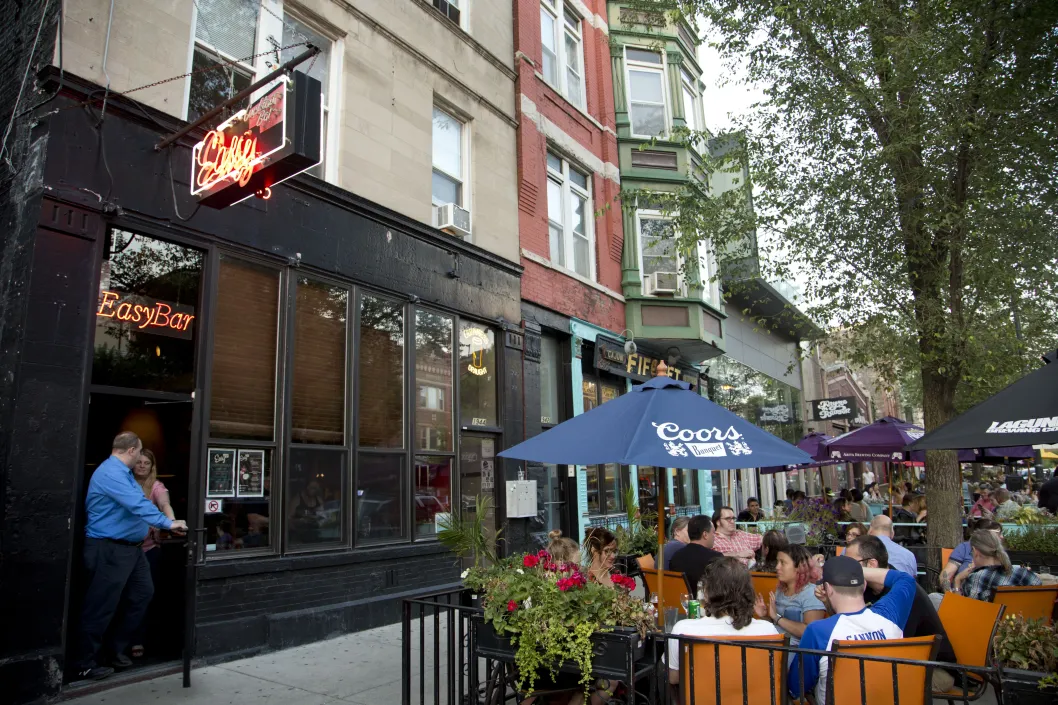 East bar front entrance and outdoor patio seating on W Division St in Wicker Park Chicago