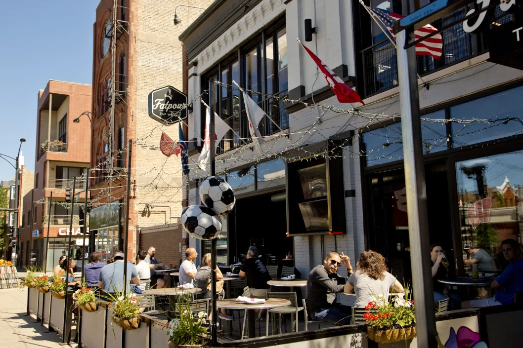 Fatpour outside seating patio with customers in Ukrainian Village Chicago