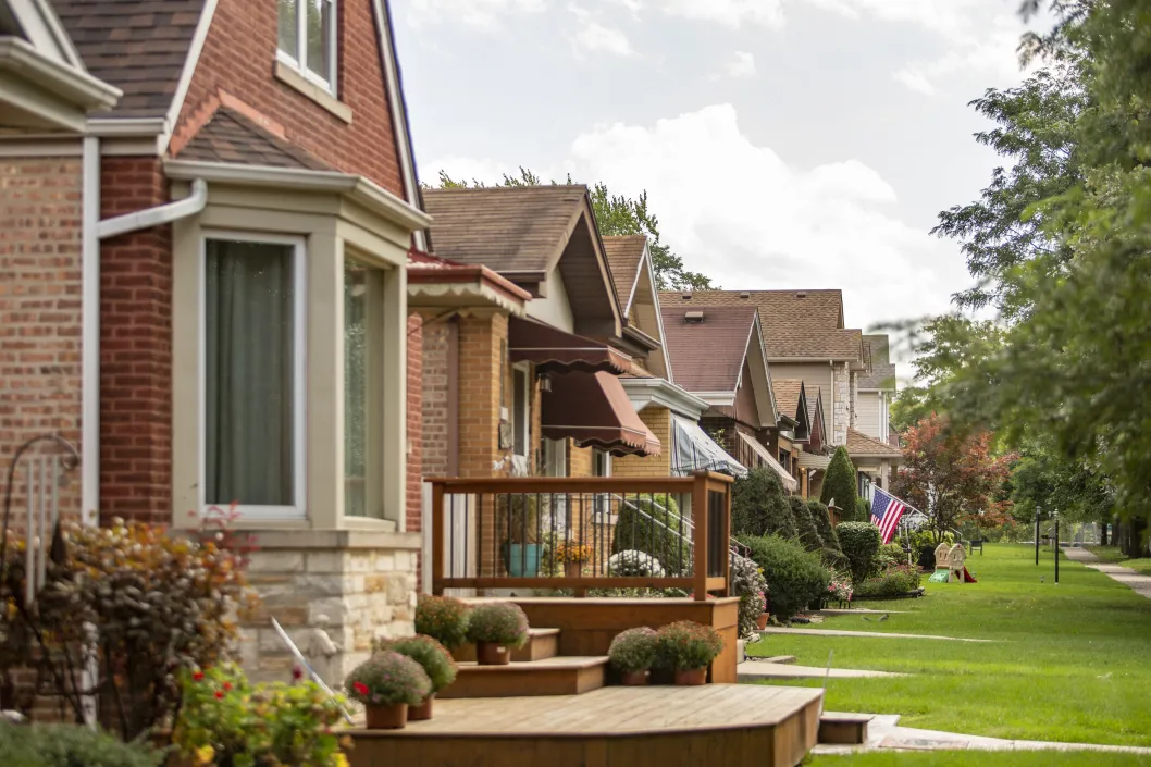 a series of homes with bright green grass front yards in Englewood Chicago