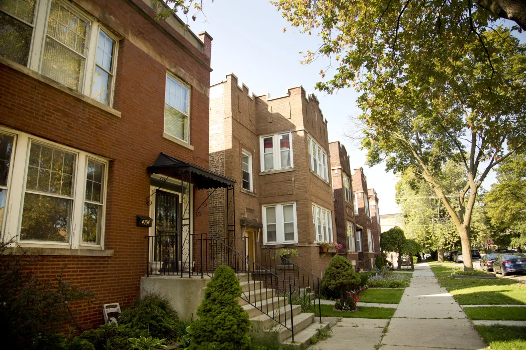 Apartment buildings and front yards on neighborhood street in Mayfair Chicago