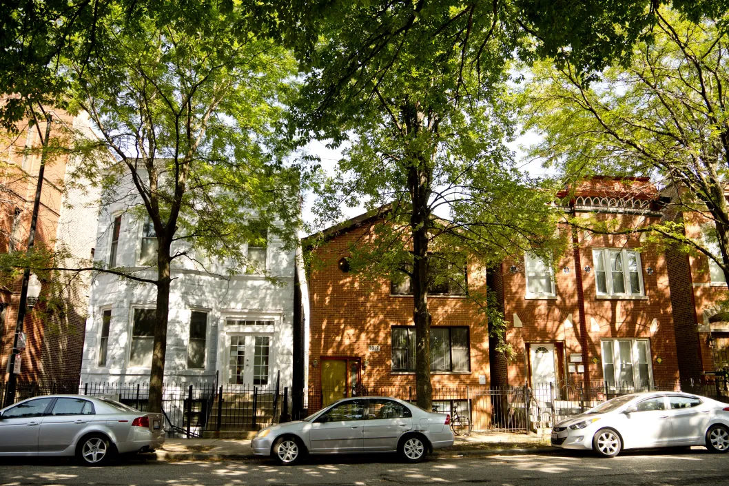 Apartment buildings and cars parked in front in Tri-Taylor Chicago