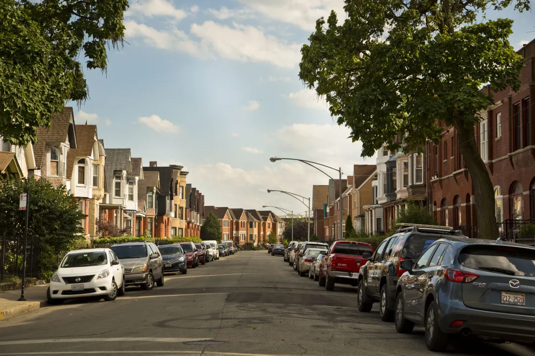 Apartments and single family homes on neighborhood street in Oakland Chicago