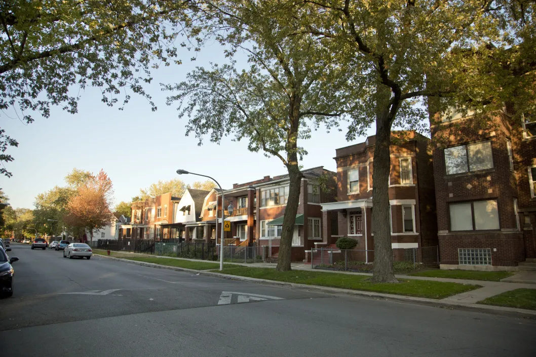 Apartments and single family homes on neighborhood street in South Shore Chicago