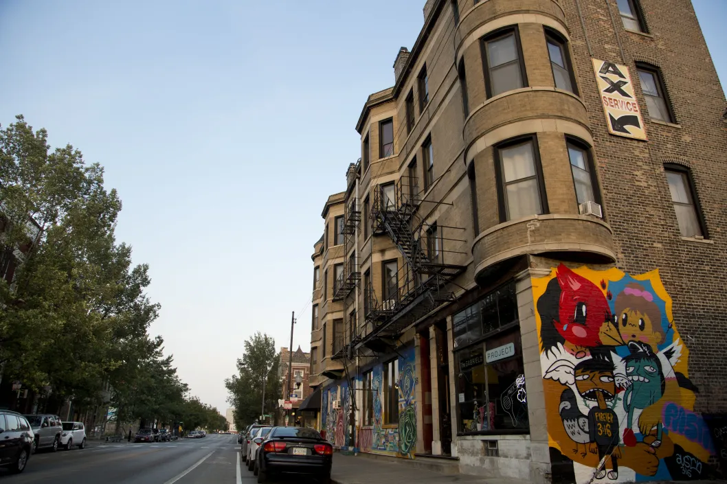 Art mural on apartment building wall exterior in Pilsen Chicago