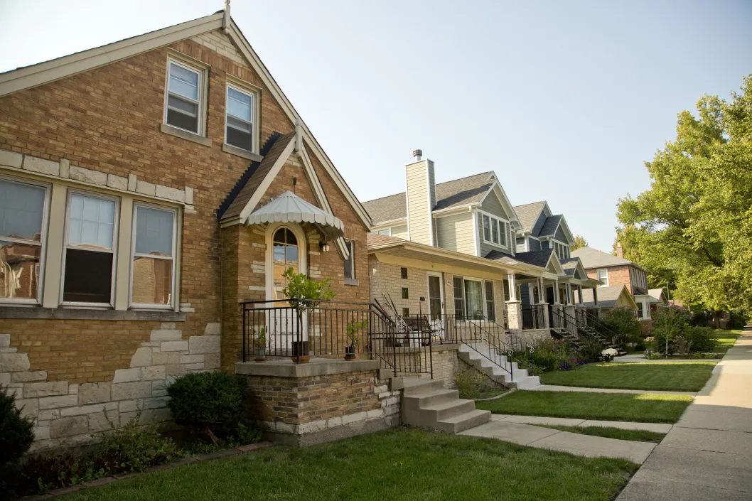 Brick single family homes and front yards in North Mayfair