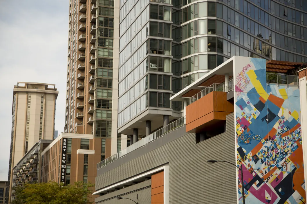 Colorful mural on apartment building wall and public art in Dearborn Park Chicago