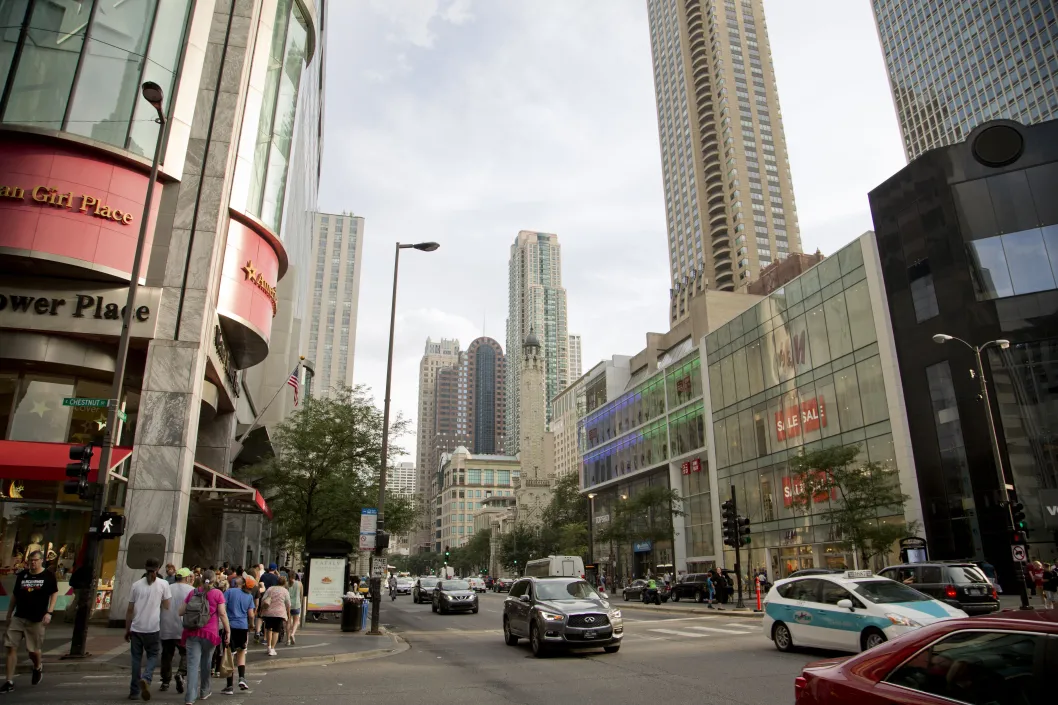 Pedestrians walking on N Michigan Ave and Water Tower Place in the Gold Coast Chicago