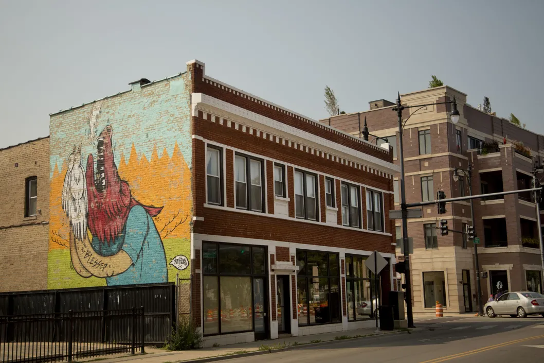 Public art mural on brick building on N Clark St in Sheridan Park Chicago