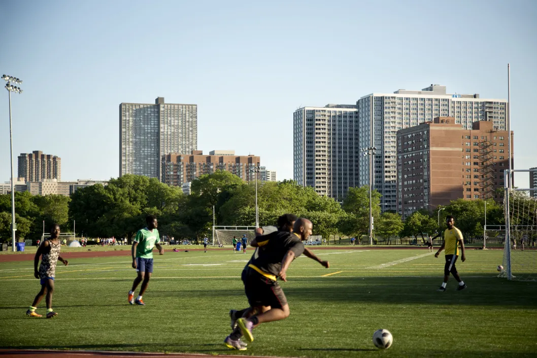 Soccer players at public park on lakefront in Uptown Chicago