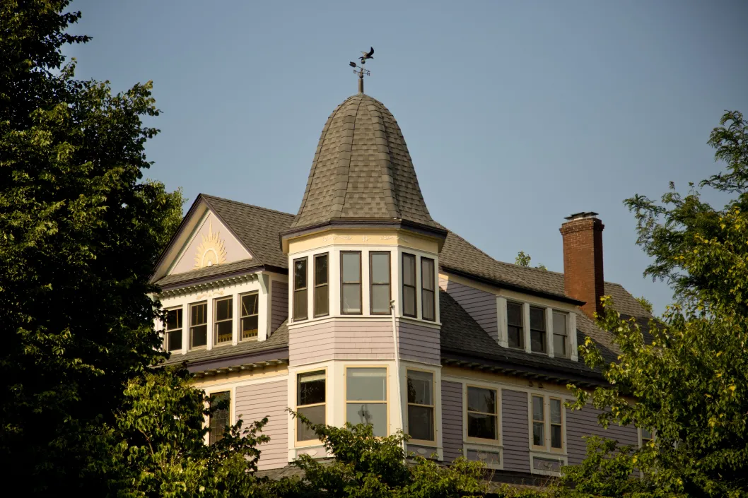 Vintage Victorian home and cupola roofline and weather vane in Ravenswood